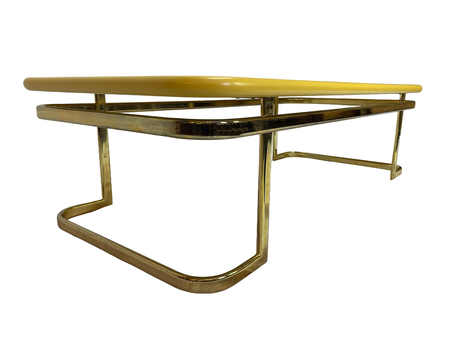 Side perspective view of 1970s Lane coffee table with brass-tone metal frame and yellow lacquer finish.