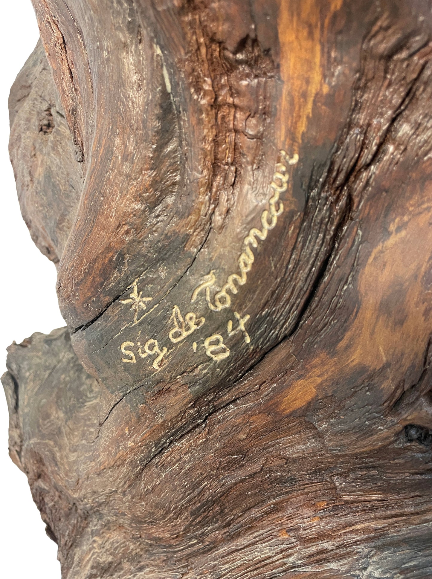 Close-up detail of signature on monumental carved wood sculpture by Sig de Tonancour dated 1984.