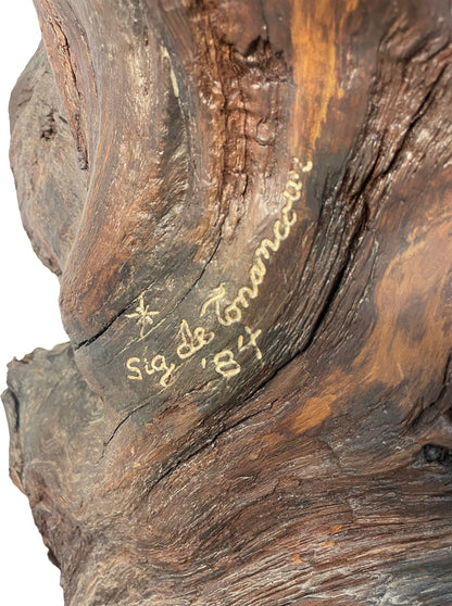 Close-up detail of signature on monumental carved wood sculpture by Sig de Tonancour dated 1984.