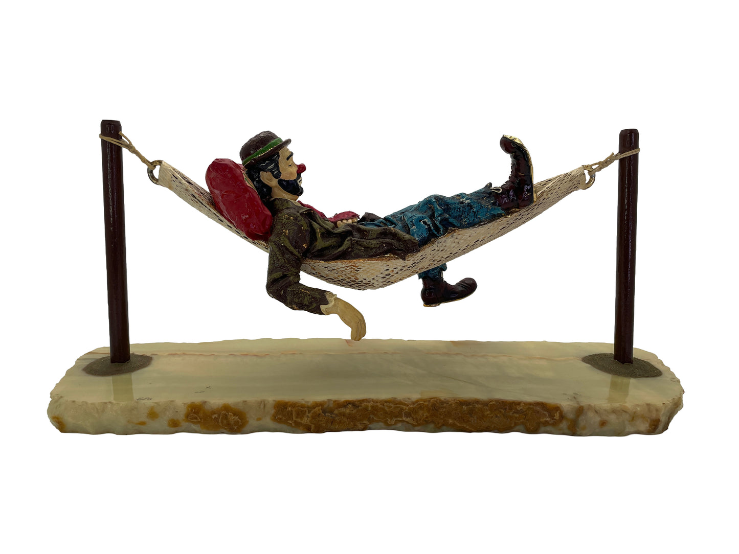 Opposite side view of a signed 1988 Ron Lee hobo clown sculpture reclining in a hammock on a natural onyx base.