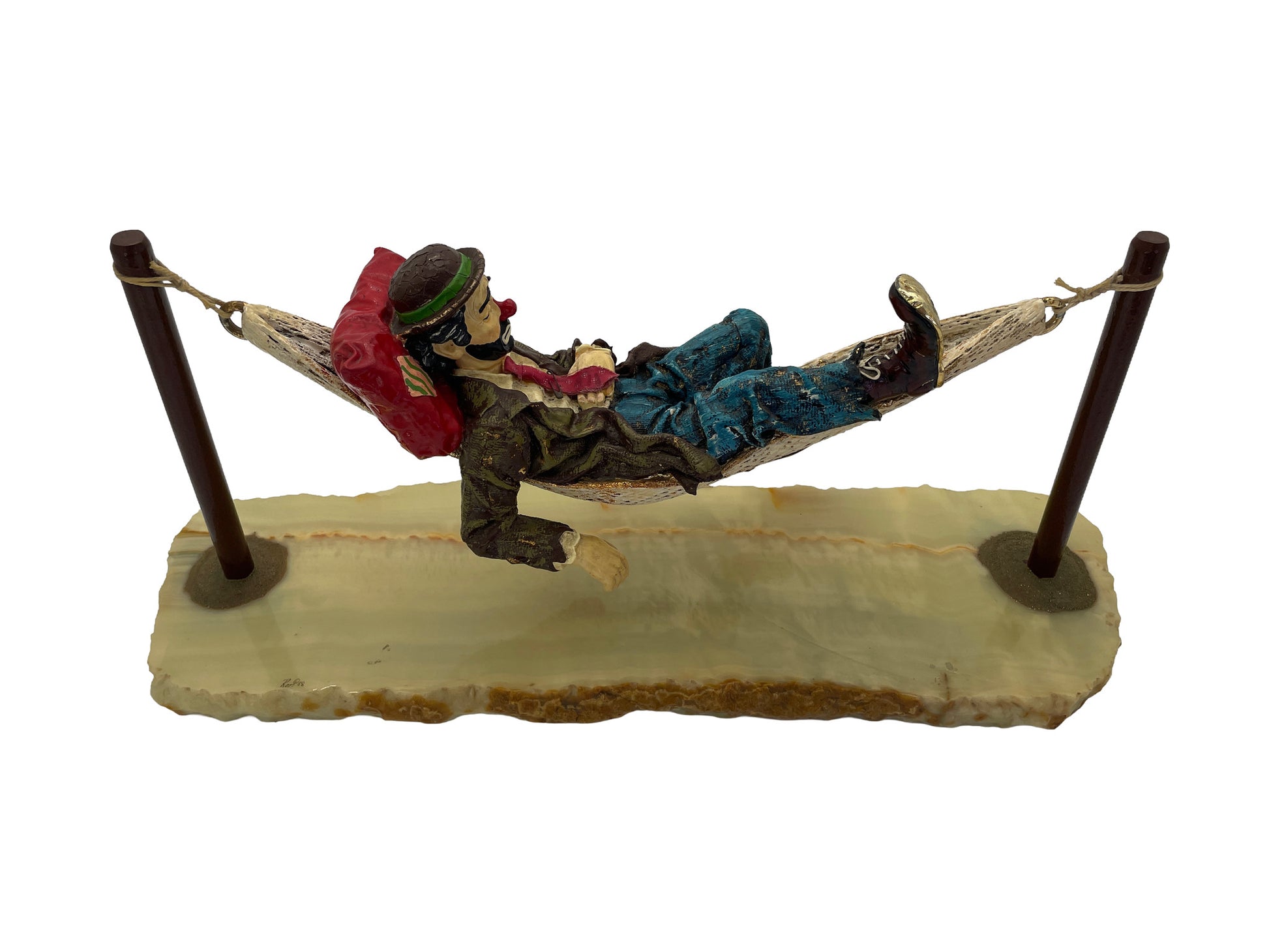 Top opposite side view of a signed Ron Lee hand-painted hobo clown sculpture featuring a suspended hammock and natural onyx base.