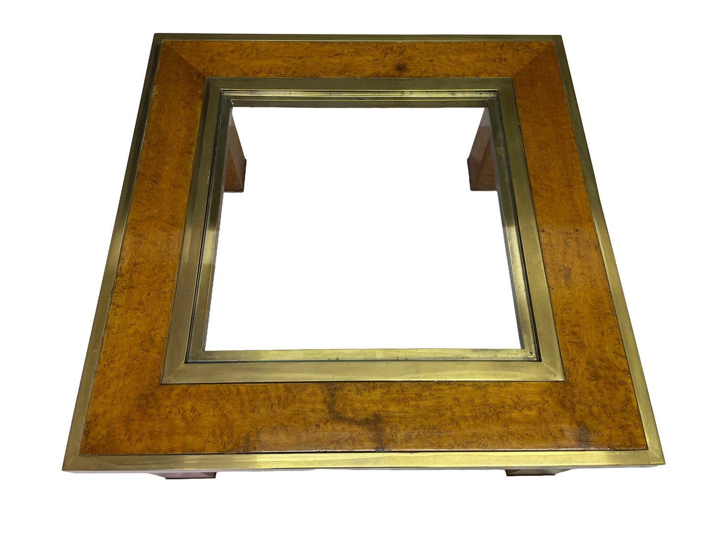 Overhead view of a square olive ash burl coffee table with brass frame and recessed glass insert.