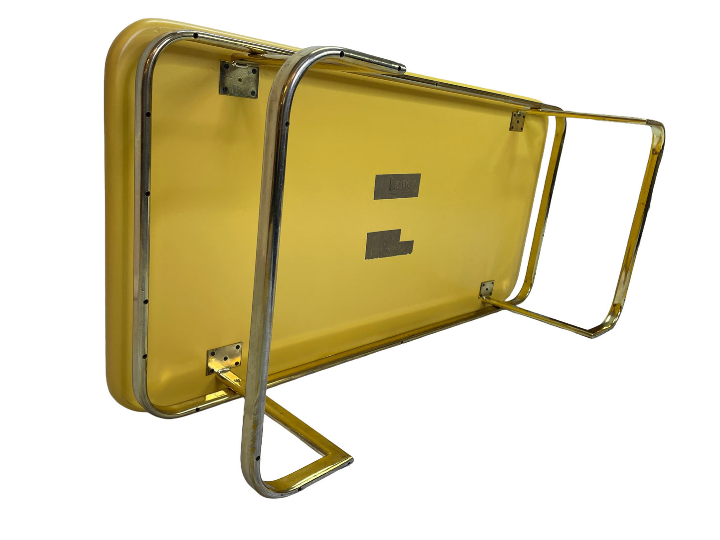 Underside angle view of vintage Lane coffee table with lemon yellow lacquer finish and brass-tone metal base.