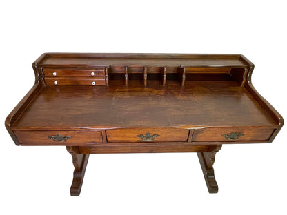 Victorian pine writing desk featuring a spacious writing surface, upper storage compartments, and small document drawers.
