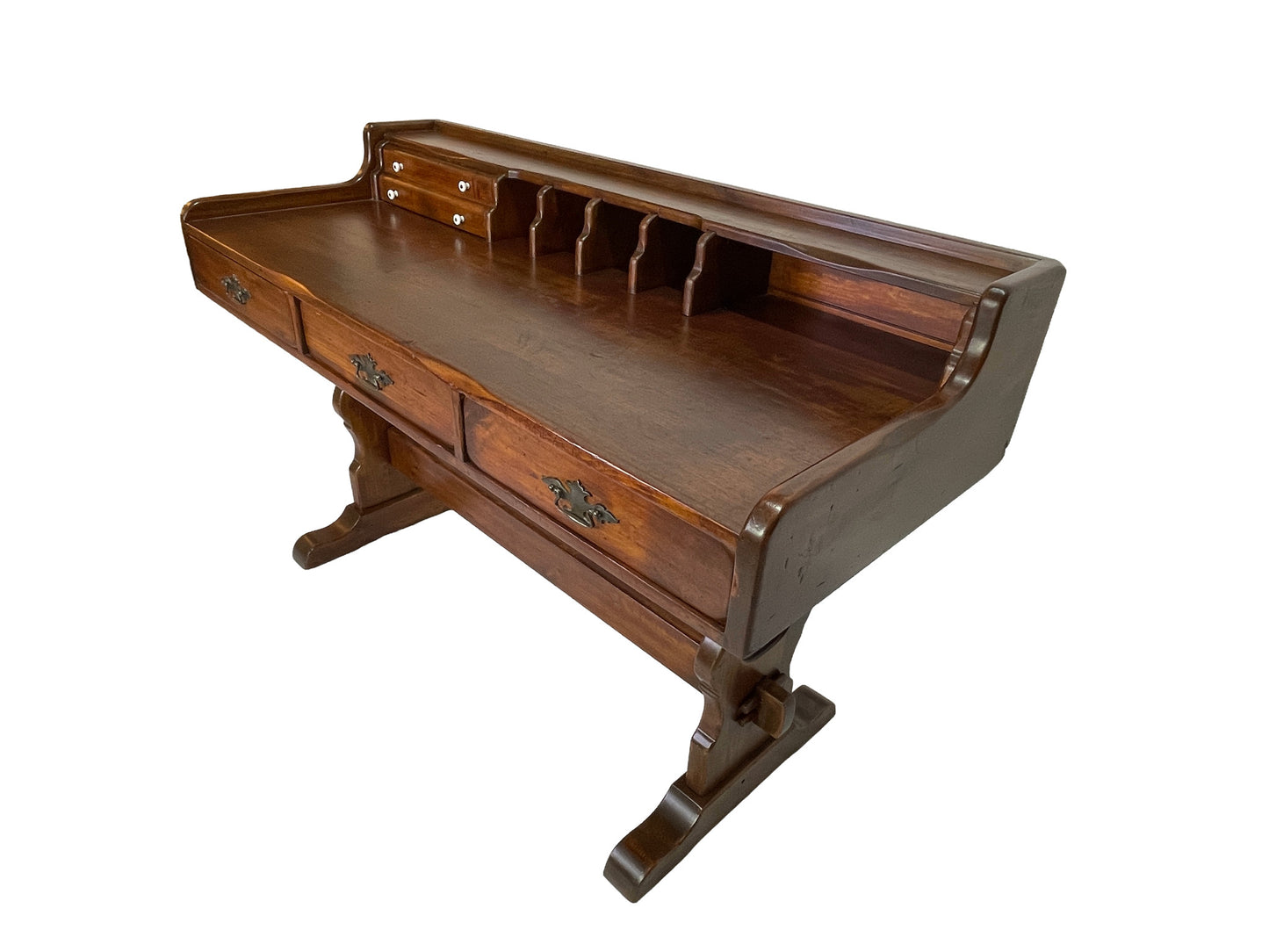 Three-quarter view of a Victorian solid pine writing desk featuring a raised hutch, storage compartments, porcelain knobs, and brass hardware.