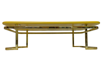 Vintage Lane Furniture coffee table featuring a yellow lacquered top and polished brass-tone metal frame.
