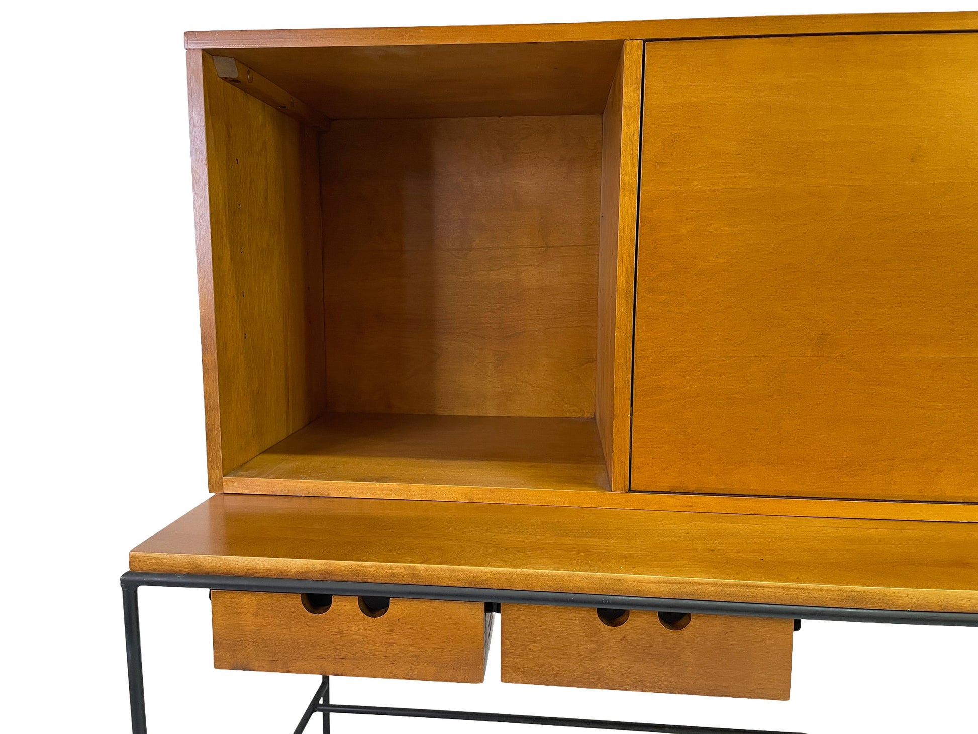 Close-up of Paul McCobb Planner Group secretary cabinet in maple with open shelving, sliding door compartment, and integrated drawers for Winchendon Furniture.