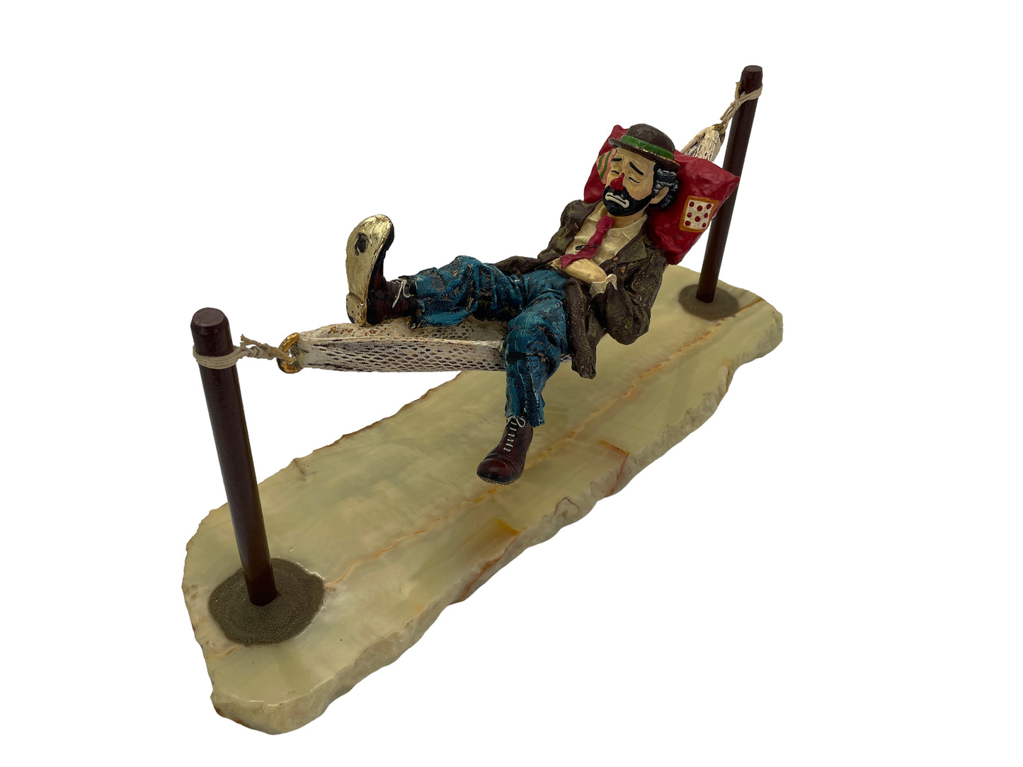 Right angle view of a vintage Ron Lee hobo clown sculpture featuring a hand-painted figure suspended in a hammock on an onyx base.