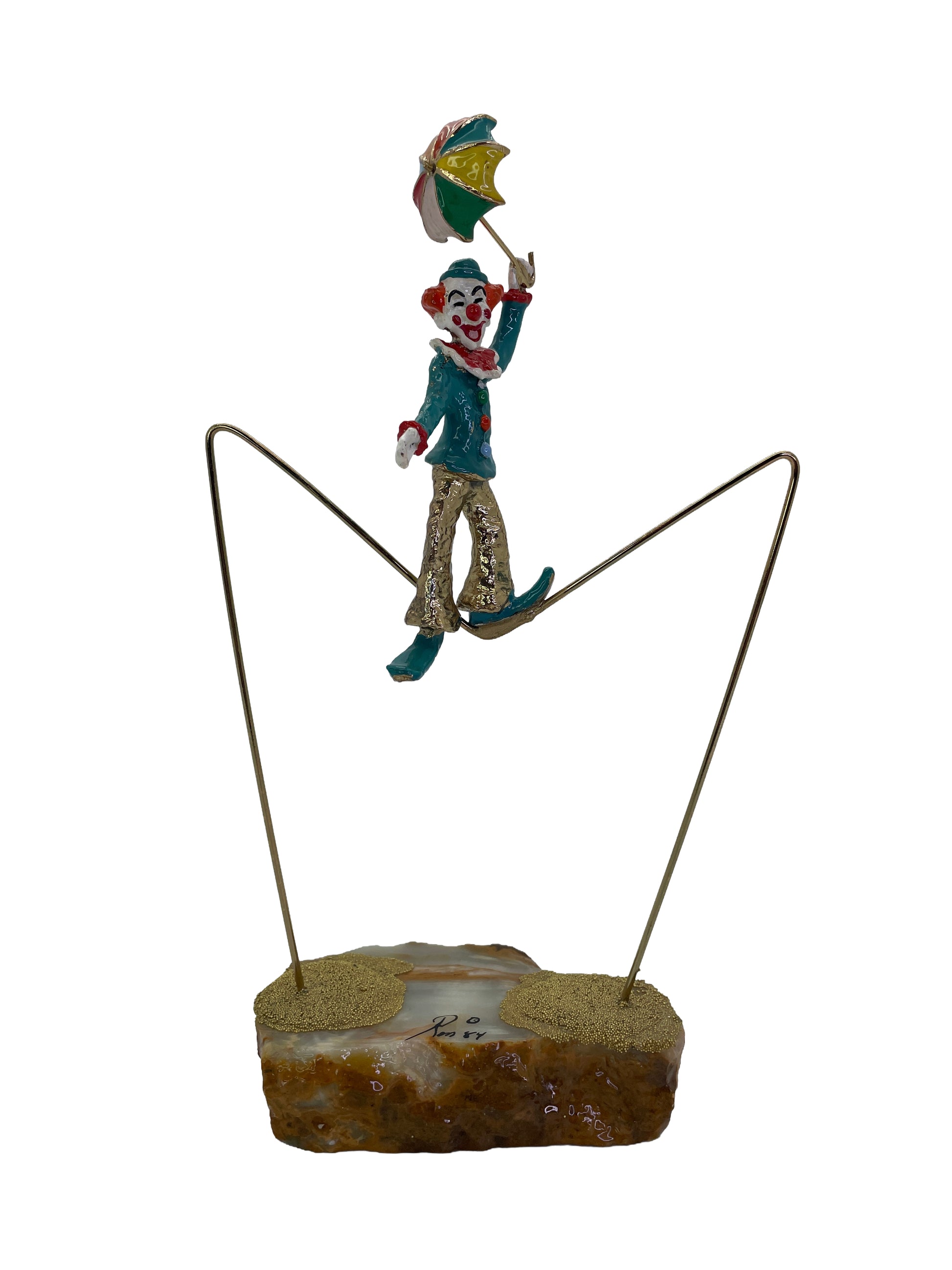 Vintage Ron Lee High Wire Circus Clown sculpture balancing on a brass tightrope with colorful umbrella and natural onyx base, signed 1984.