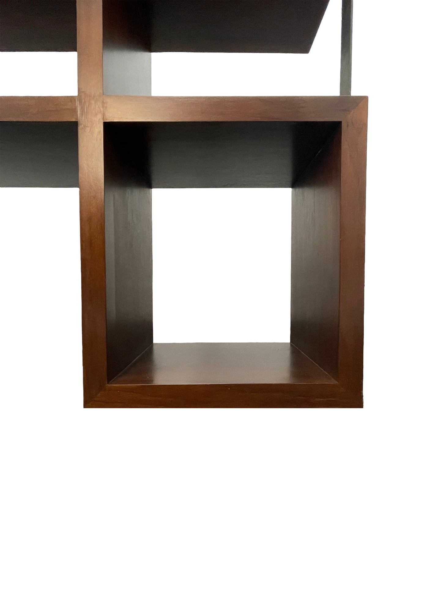 Lower section detail of walnut bookcase with open storage cubby and rich wood finish