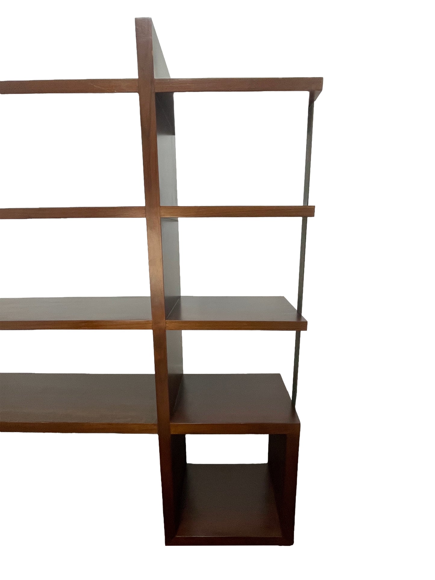 Detail of intersecting walnut shelves highlighting architectural structure and craftsmanship