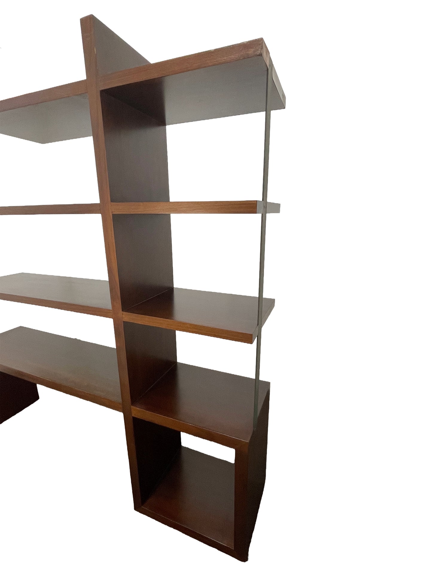 Angled view of detail of intersecting walnut shelves highlighting architectural structure and craftsmanship